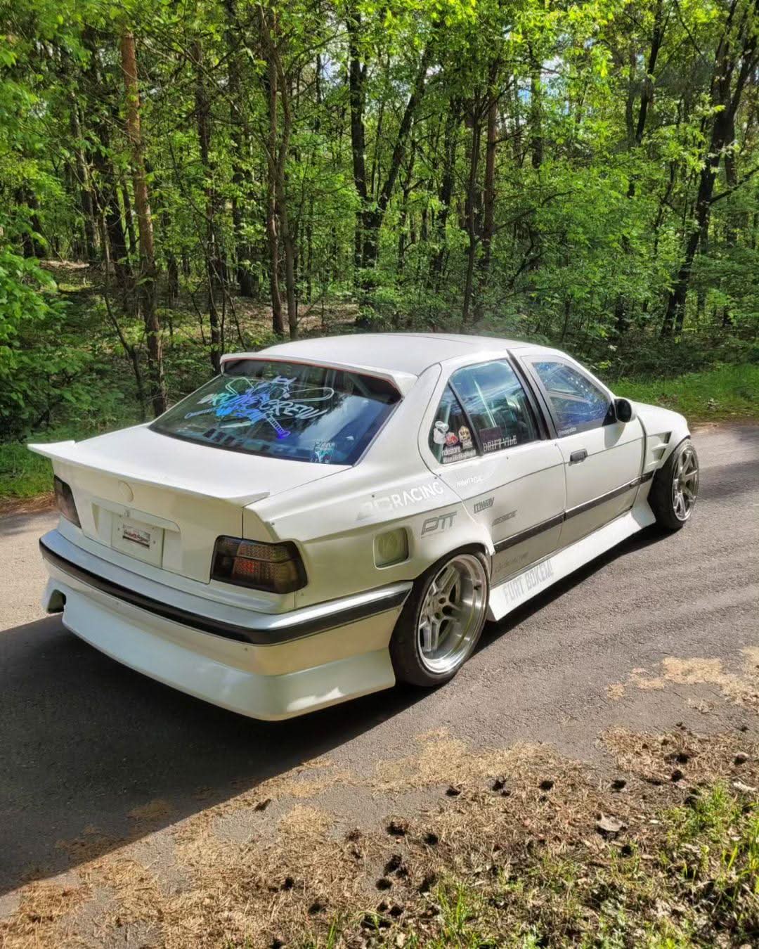 BMW E36 Vented Front Over-Fenders by K2 Industries, showing close-up of vented metal fenders on a 1990s BMW E36.