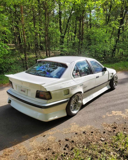 BMW E36 Vented Front Over-Fenders by K2 Industries, showing close-up of vented metal fenders on a 1990s BMW E36.