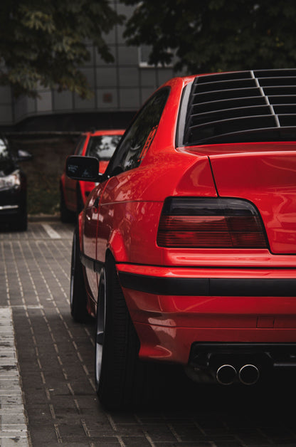 Black windshield louvers for BMW E36 Coupe Series 3 from K2 Industries, designed for the 1992-1999 model years.