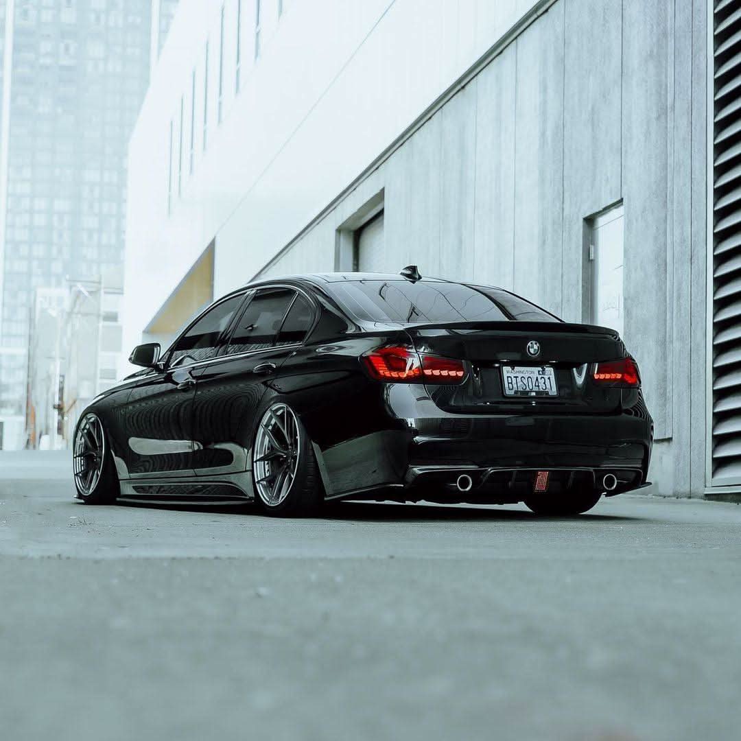 BMW 3-Series F30 F35 F80 GTS style OLED dynamic tail lights in red or smoked by K2 Industries, shown on a 2012-2019 model.