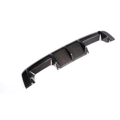 Carbon fiber rear diffuser for BMW G80 M3 and G82/G83 M4, designed by Palenon Performance, showing sleek aerodynamic details.