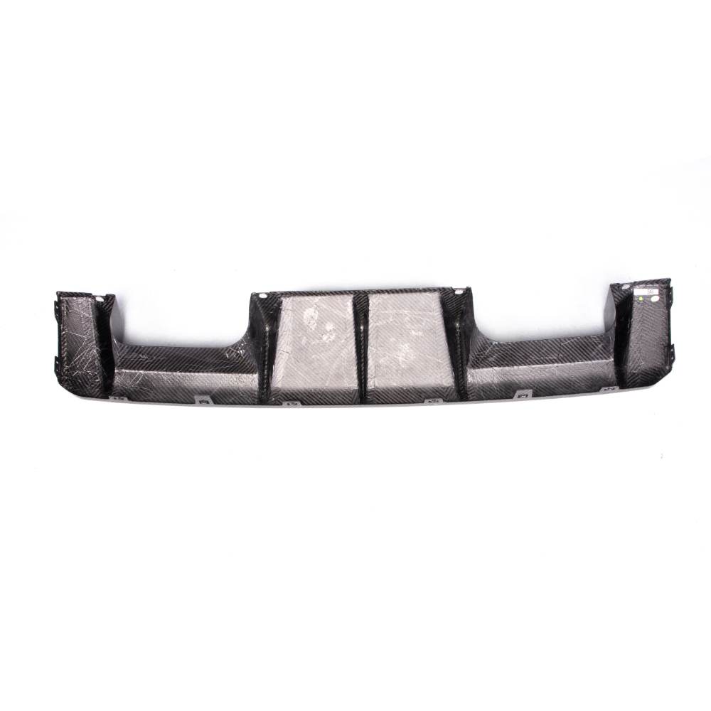 Carbon fiber rear diffuser for BMW G80 M3 and G82/G83 M4, designed by Palenon Performance, shown on a car.