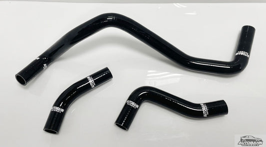 Autobahn Autoworx coolant hose kit for VW MK4 Golf, Jetta, Beetle, with three flexible rubber hoses installed in engine bay.