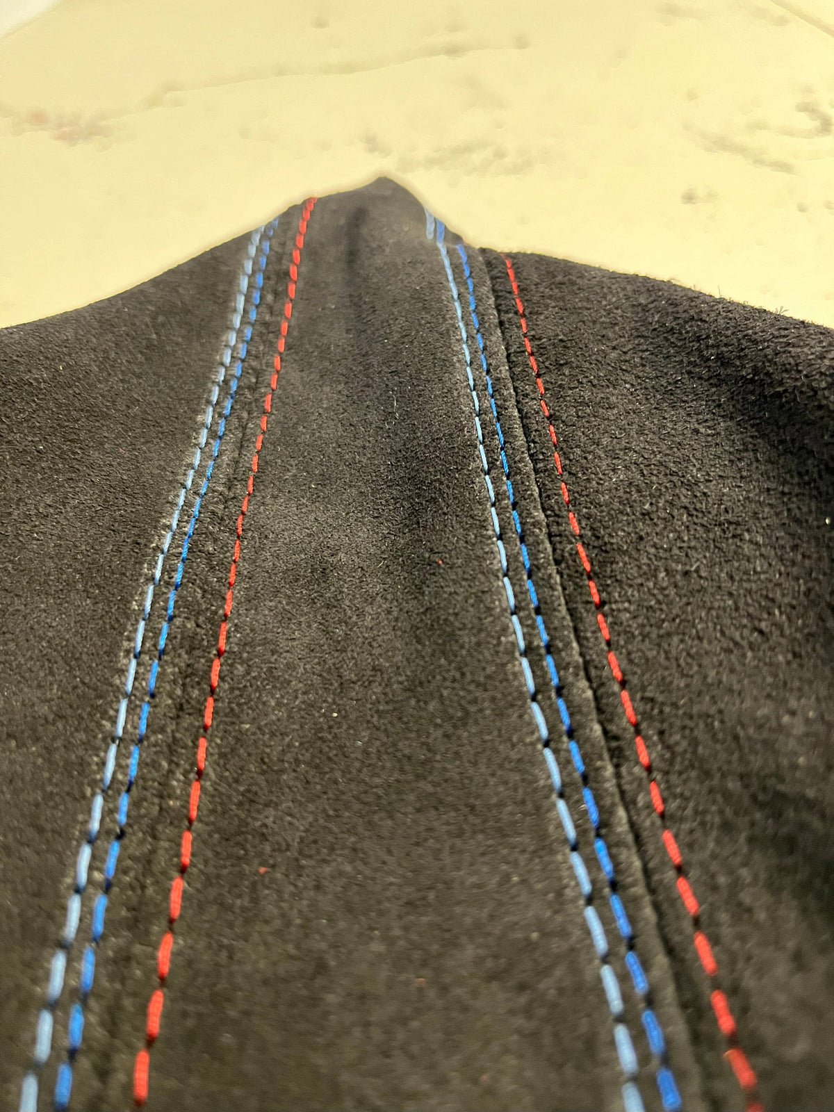 Genuine suede BMW E36 parking brake and shift boot cover with M stitch, console cover by JTS Custom Upholstery.