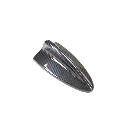 Carbon fiber roof antenna cover for BMW E82, E87, E90, E92, E93 by Palenon Performance, shown on vehicle roof.