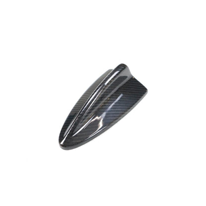 Carbon fiber roof antenna cover for BMW E82, E87, E90, E92, E93 by Palenon Performance, showing the sleek textured finish.