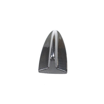 Carbon fiber roof antenna cover for BMW E82, E87, E90, E92, E93 from Palenon Performance, showcasing sleek, textured finish on vehicle roof.