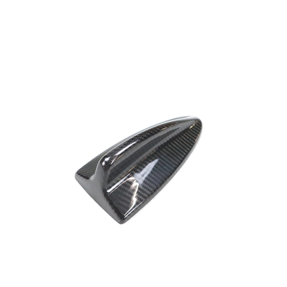 Black carbon fiber roof antenna cover for BMW E82, E87, E90, E92, and E93 models by Palenon Performance.