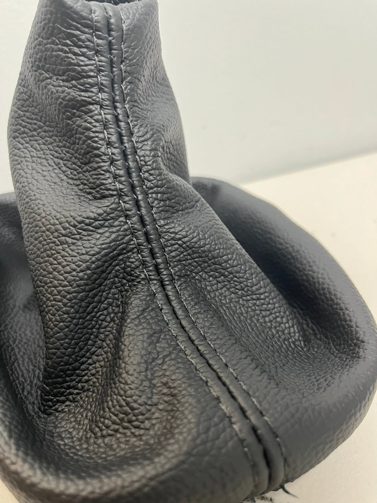 Genuine top grain leather BMW E36 E46 manual shift boot cover with retainer frame, custom upholstery by JTS.