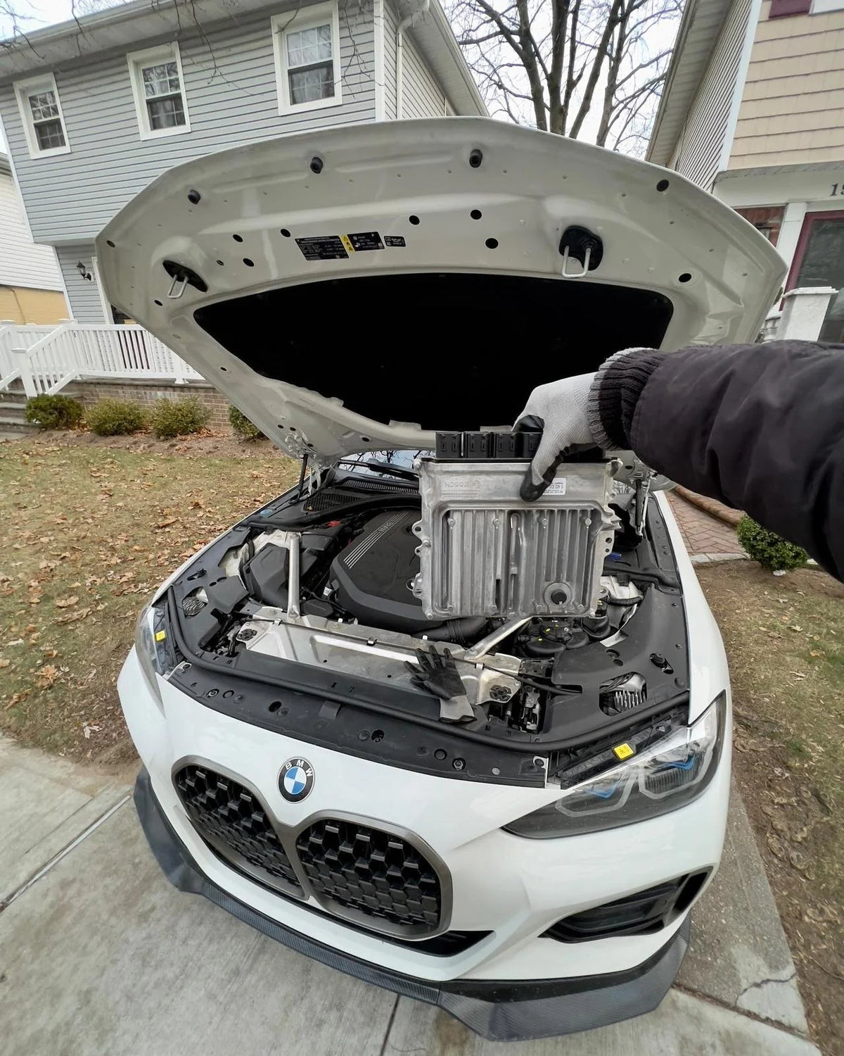 BMW ECU full unlock and Bootmod3 tuning kit from BOOTMOD3 TUNING USA shown on a digital device screen.