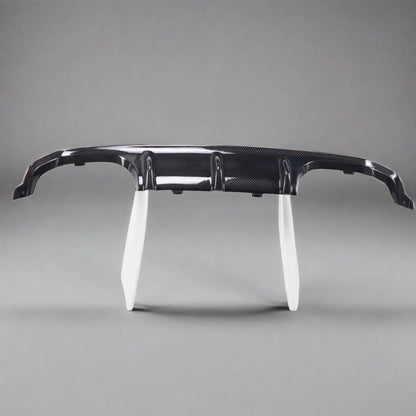 BMW F80 M3 and F82/F83 M4 carbon fiber rear diffuser by Palenon Performance, showcasing sleek, lightweight aerodynamic design.