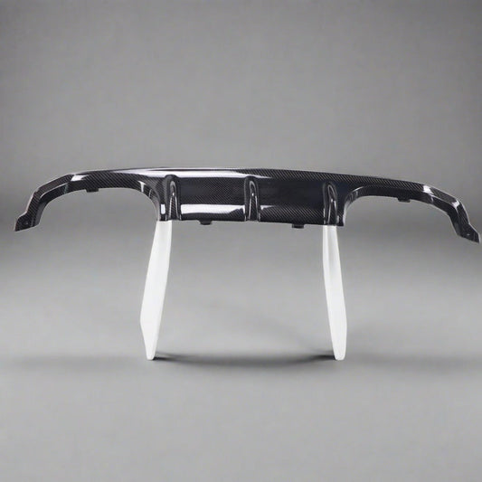 BMW F80 M3 and F82/F83 M4 carbon fiber rear diffuser by Palenon Performance, showcasing sleek, lightweight aerodynamic design.