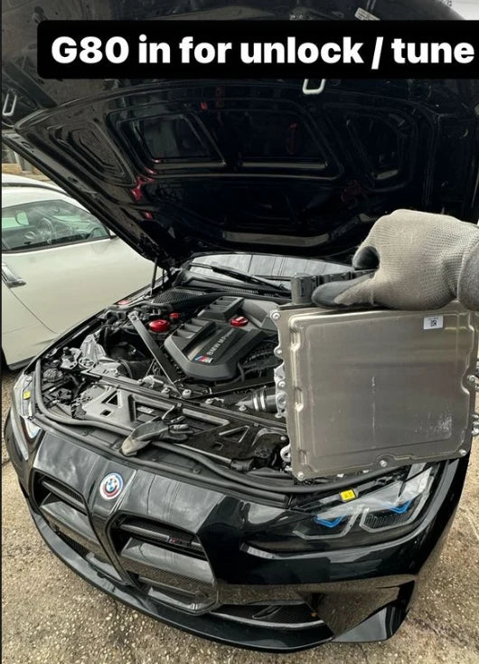 BMW ECU full unlock and Bootmod3 tuning kit from BOOTMOD3 TUNING USA, showing the ECU and tuning interface on a workbench.