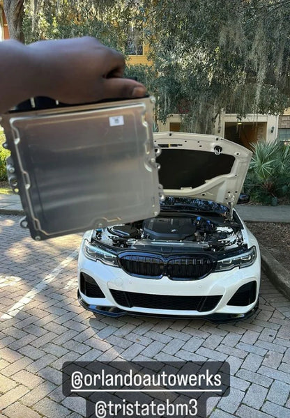 BMW ECU full unlock and Bootmod3 tuning by BOOTMOD3 TUNING USA, showing the ECU unit and tuning interface.