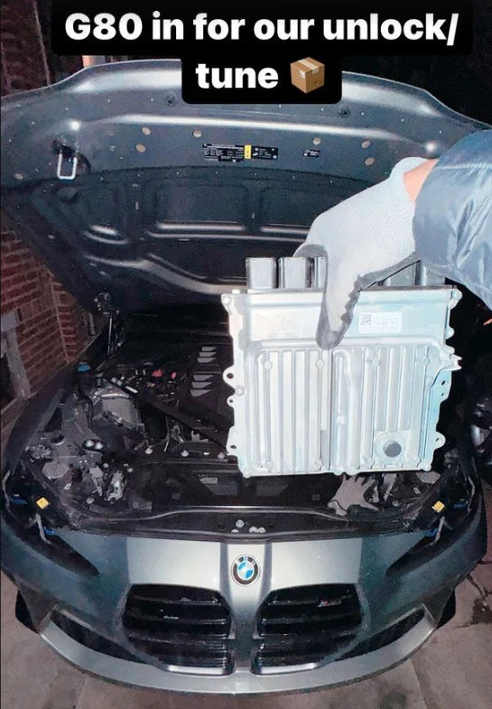 BMW ECU full unlock and Bootmod3 tuning kit installed, showing the engine bay with ECU module and tuning interface.