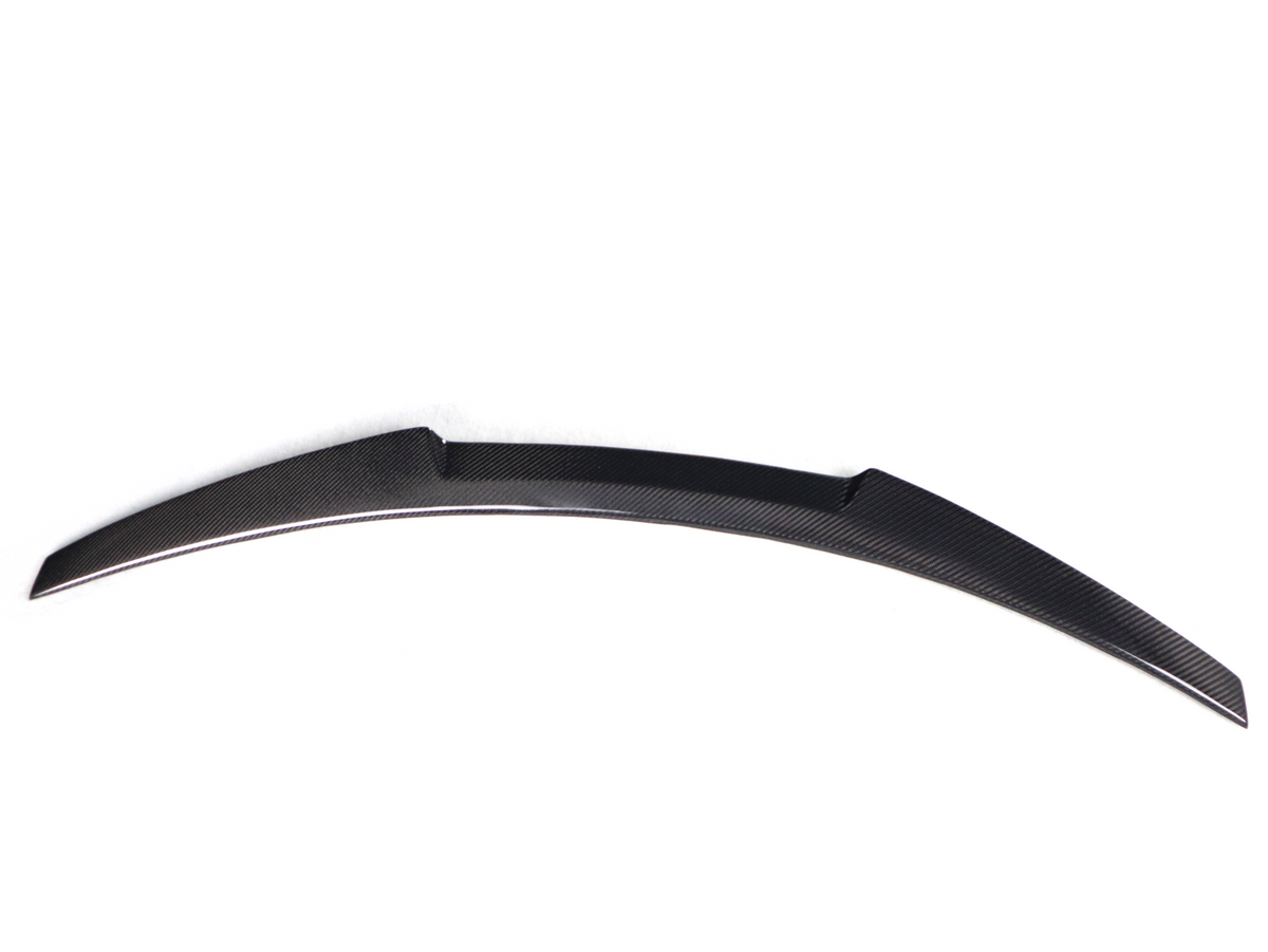 BMW F82 M4 V Style trunk spoiler in carbon fiber, lightweight aerodynamic design for enhanced sporty look.