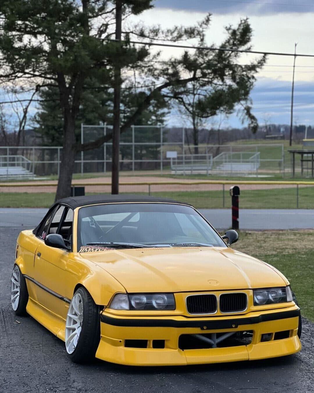 BMW 3-Series E36 coupe convertible with JDM style ABS plastic body kit by K2 Industries, showing front and side view.