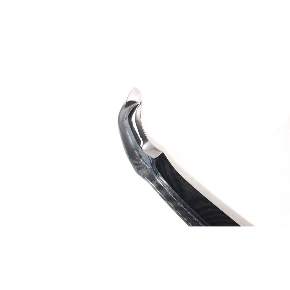 Carbon fiber Vorsteiner front lip for BMW F80 M3 and F82/F83 M4, showcasing sleek, aerodynamic design on a sports car.