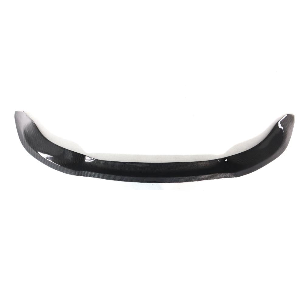 Carbon fiber Vorsteiner front lip for BMW F80 M3 and F82/F83 M4, showcasing sleek, aerodynamic design on a sports car.