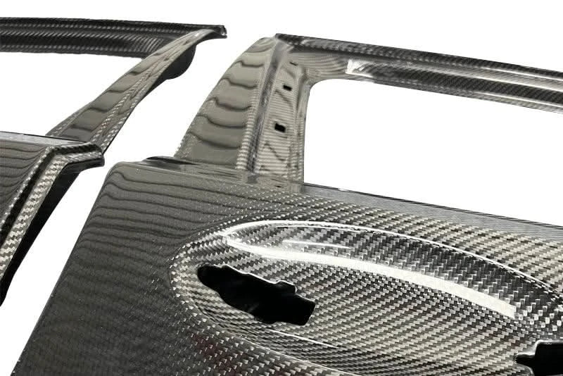 BMW 3 Series G20 G80 M3 carbon fiber doors by K2 Industries, showing sleek black finish and lightweight construction.