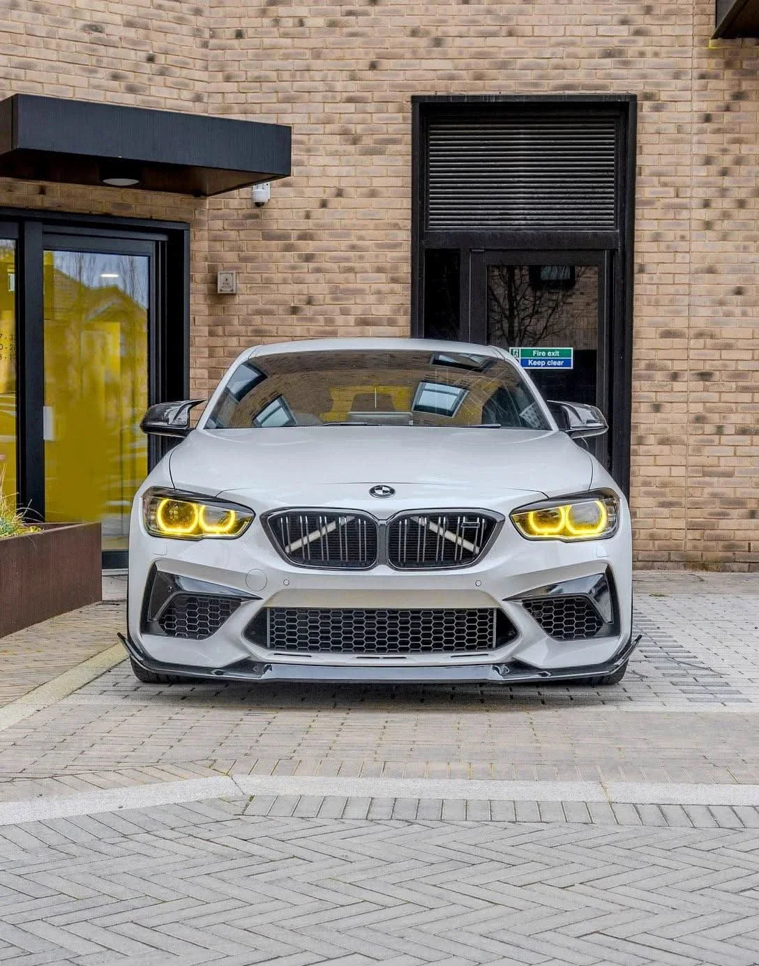 K2 Industries BMW 1 Series F20/F21 DRL Module (2015-2019) with automotive lighting components, black plastic housing and wiring connections.