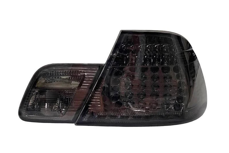 BMW E46 Coupe clear smoked LED tail lights by K2 Industries, showing sleek, smoked lens design with LED illumination.
