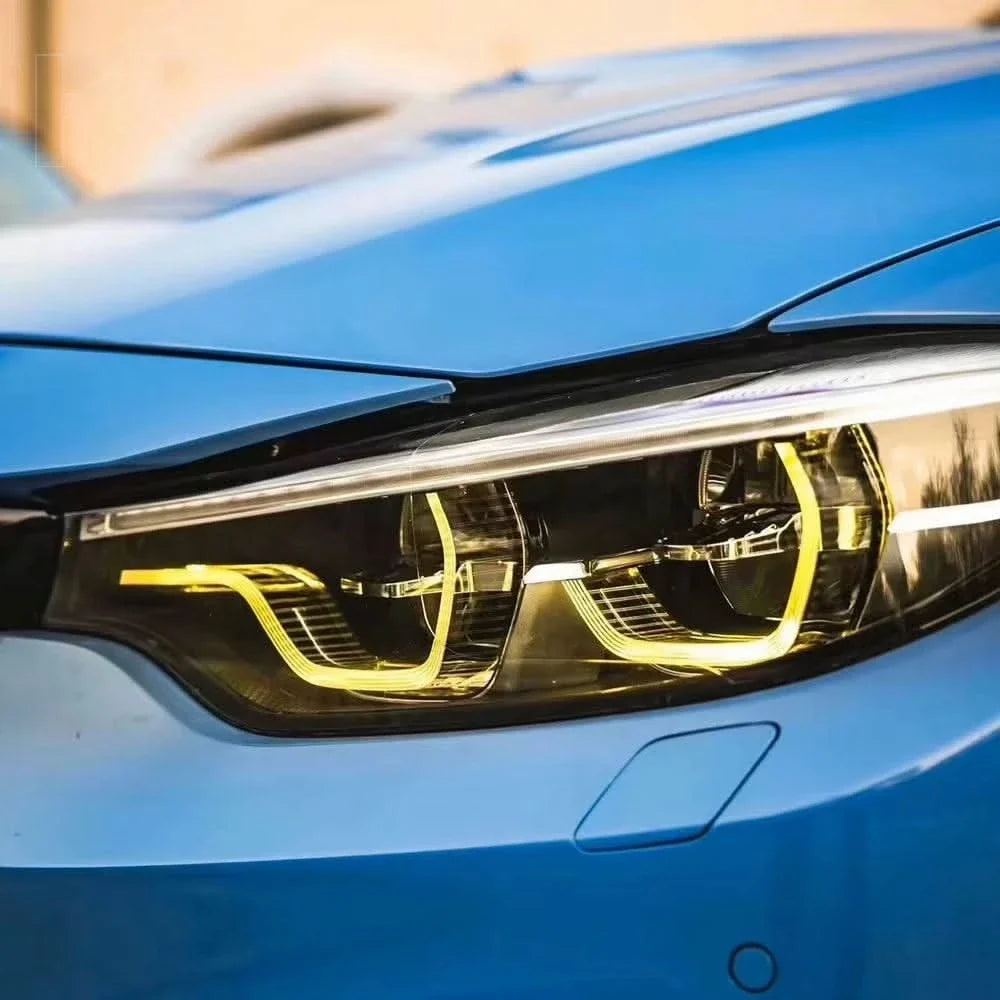 K2 Industries BMW M3 F80 M4 F82 F83 LCI DRL module installed in a 2013-2019 vehicle, showing the LED daytime running light setup.