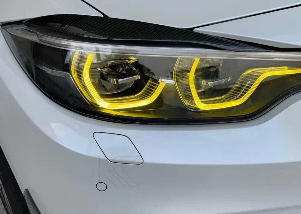 K2 Industries BMW 3/4 Series M3 F80 M4 F82 F83 LCI DRL module installed on vehicle, showcasing bright daytime running lights.