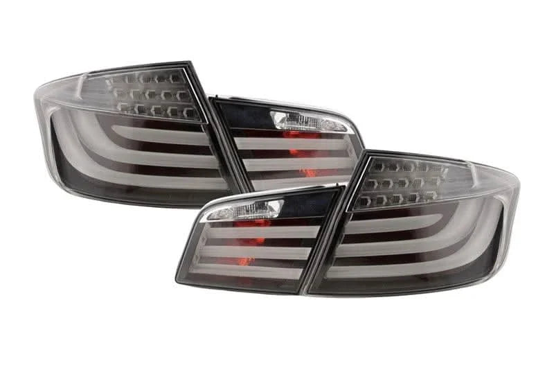 Black LED tail lights for BMW 5-Series F10 sedan, 2010-2012, by K2 Industries, showing the sleek taillight design.