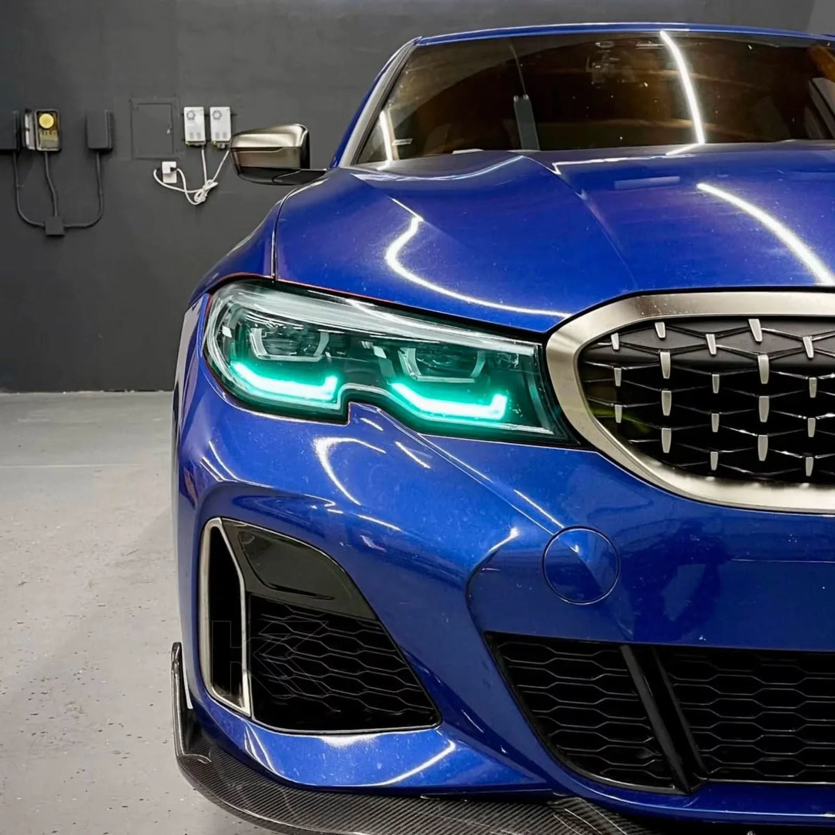 K2 Industries BMW 3 Series G20 DRL headlight module with vibrant yellow daytime running lights for 2019-2022 models.
