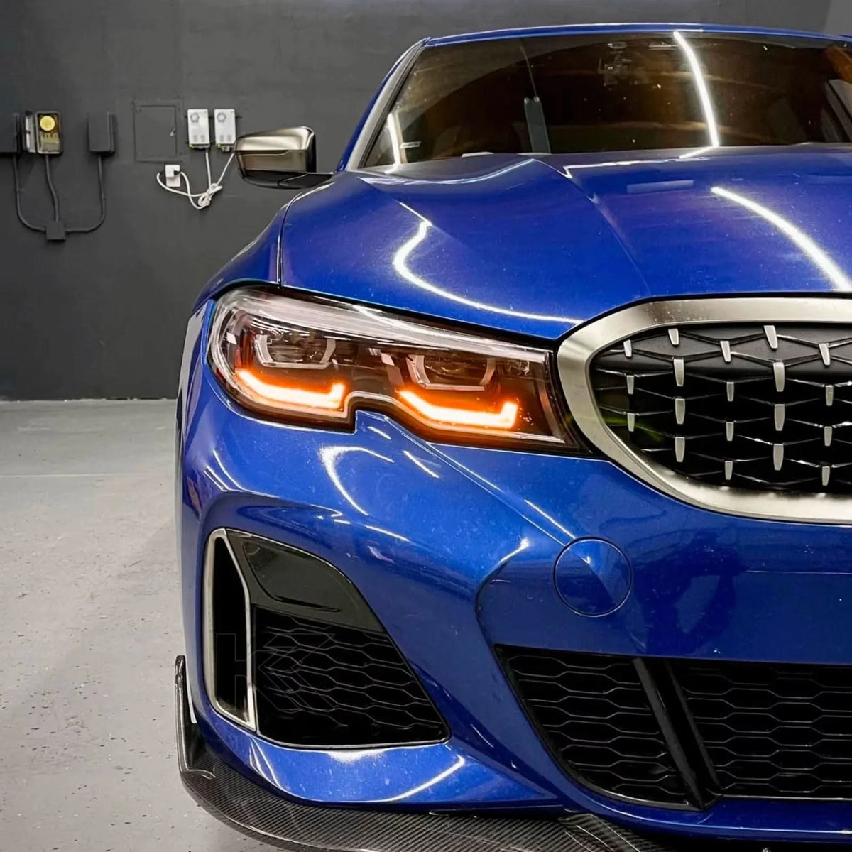 K2 Industries BMW 3 Series G20 DRL headlight modules with vibrant yellow daytime running lights for 2019-2022 models.
