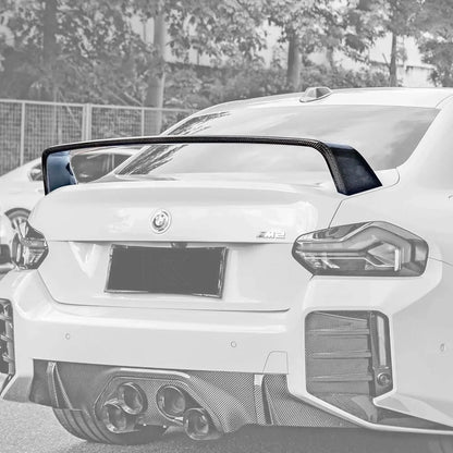 BMW 2 Series G87 M2 carbon fiber MP style wing by K2 Industries, showcasing aerodynamic design and sleek carbon fiber finish.