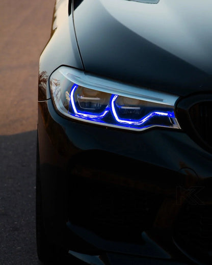 BMW 5 Series G30 G31 G38 CSL Vibrant DRL Module by K2 Industries installed in front of vehicle, showcasing bright daytime running lights.