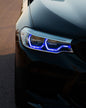 BMW 5 Series G30 G31 G38 CSL Vibrant DRL Module by K2 Industries installed in front of vehicle, showcasing bright daytime running lights.