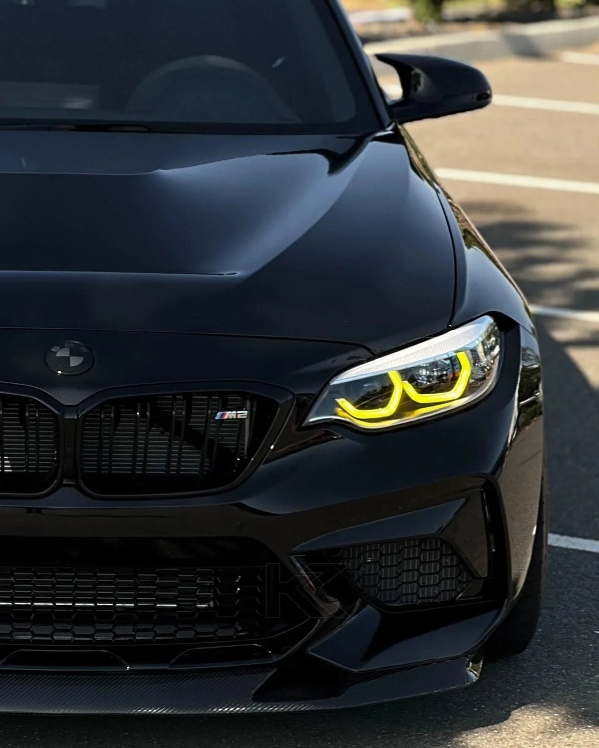 BMW 2 Series F87 DRL module by K2 Industries, showing the sleek black plastic housing and electrical connectors for daytime running lights.