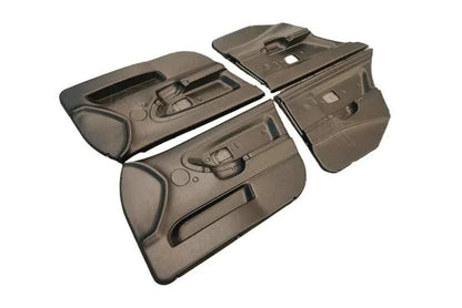 Lightweight door cards for BMW 3 Series E36 sedan by K2 Industries, showing sleek black trim panels inside the car's interior.