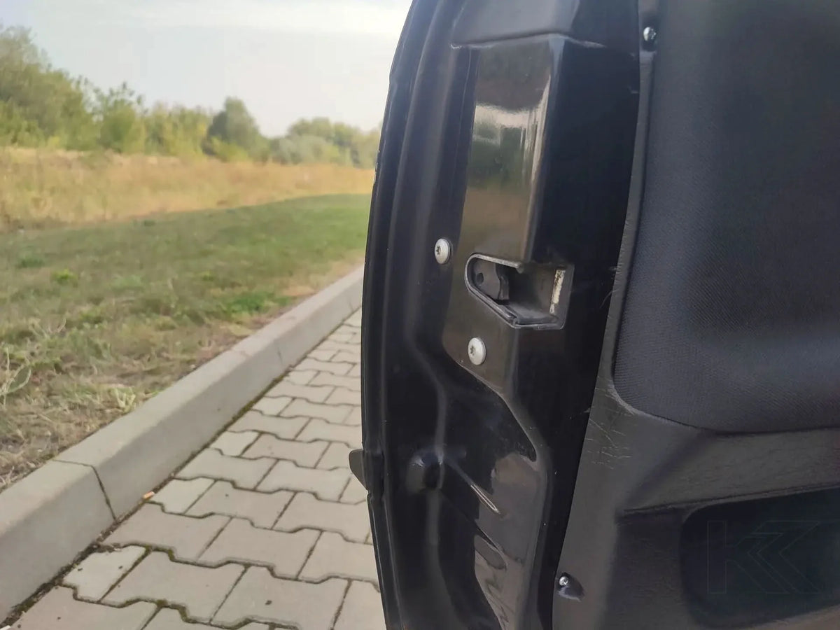 BMW 3 Series E36 sedan door cards and trim panel lightweight kit by K2 Industries, showing sleek black interior door panels.