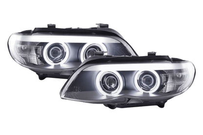BMW X5 E53 headlights with black angel eyes and LED accents, manufactured by K2 Industries for 2003-2006 models.