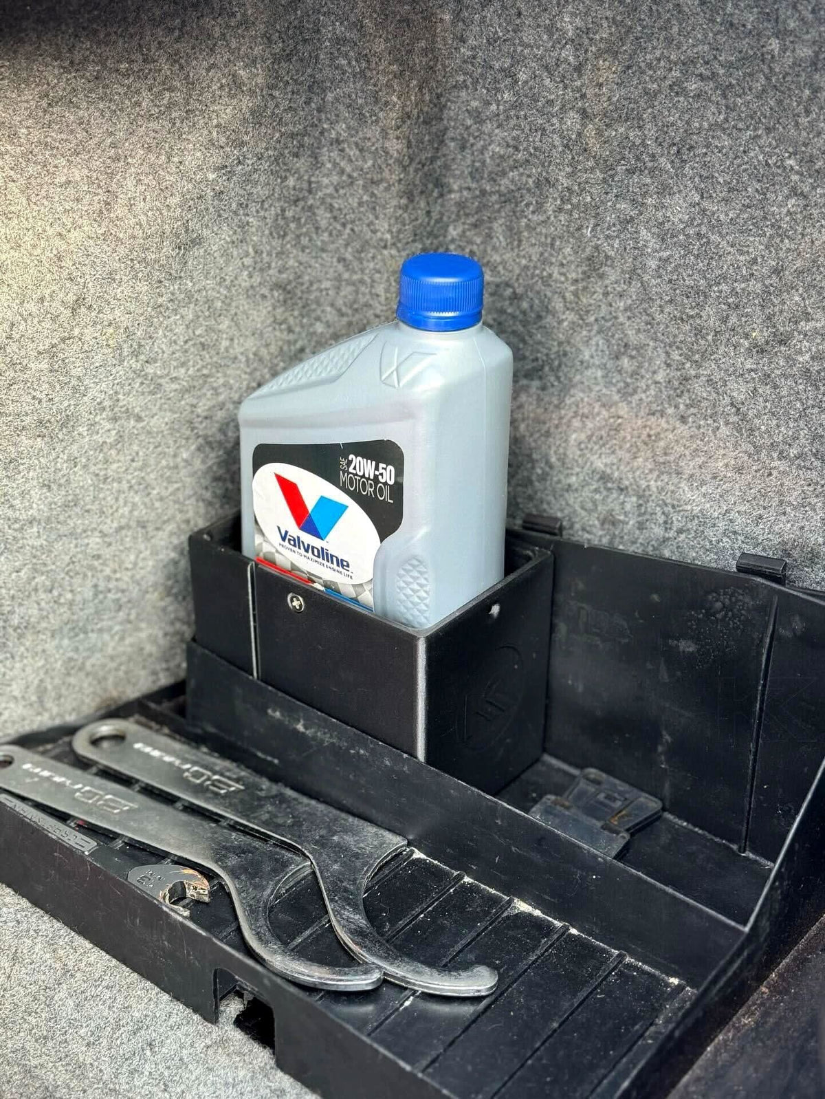 Black 3D printed plastic oil holder for BMW E36 Coupe, Sedan, Compact Series 3 from K2 Industries, 1991-2000 model.