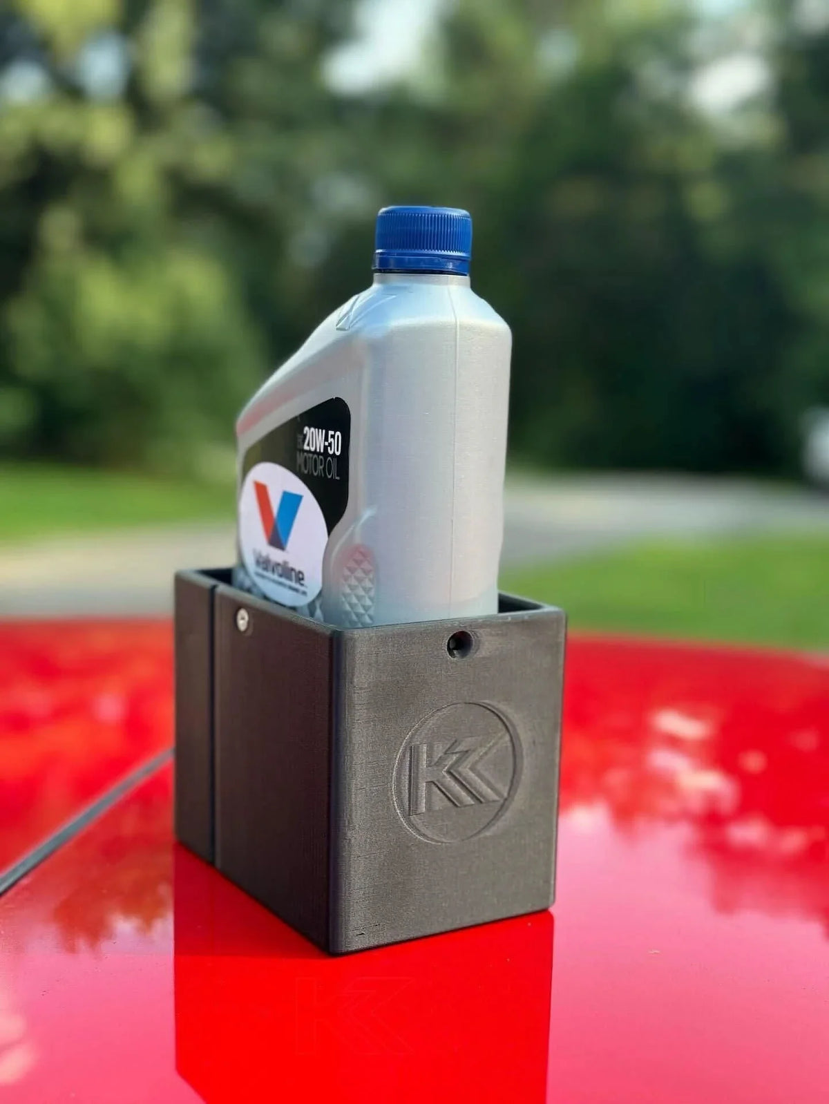 Black 3D printed plastic oil holder for BMW E36 Coupe, Sedan, and Compact Series 3 by K2 Industries, compatible with 1991-2000 models.