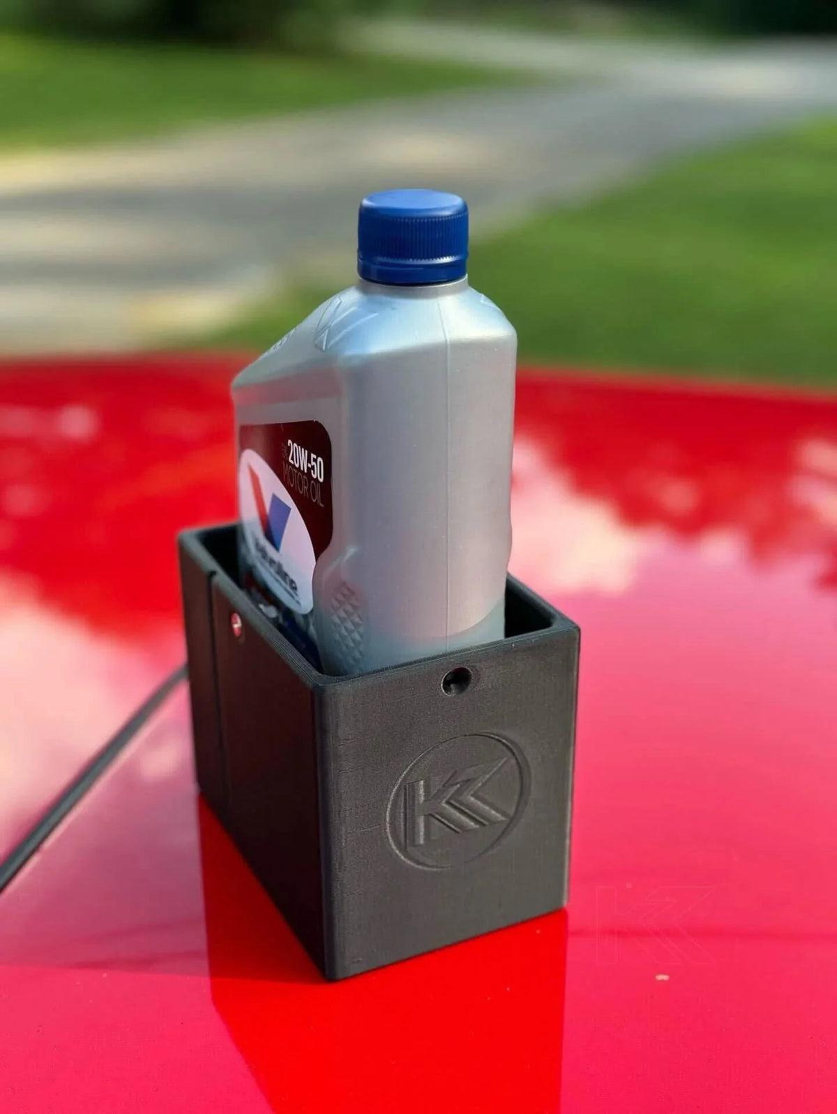 Black 3D printed plastic oil holder for BMW E36 Coupe, Sedan, Compact Series 3 from K2 Industries, fits 1991-2000 models.