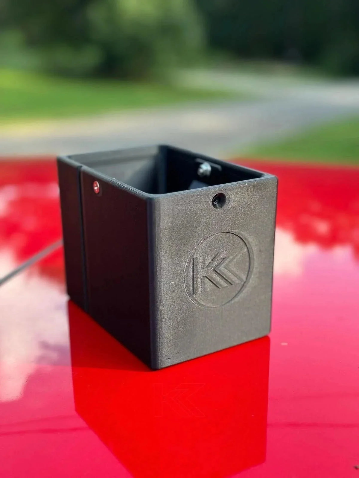 Black 3D printed oil holder for BMW E36 Coupe, Sedan, Compact Series 3 by K2 Industries, showing the oil reservoir and mounting details.