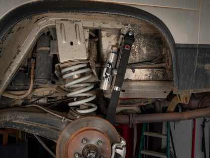 GoWesty rear suspension limit strap set for 2WD Vanagon, 23-inch length, installed on vehicle's suspension system.