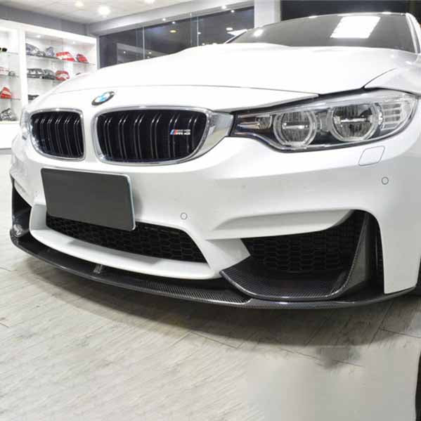 Carbon fiber front lip for BMW F80 M3 and F82 M4 by Palenon Performance, showcasing sleek, aerodynamic design on the vehicle.