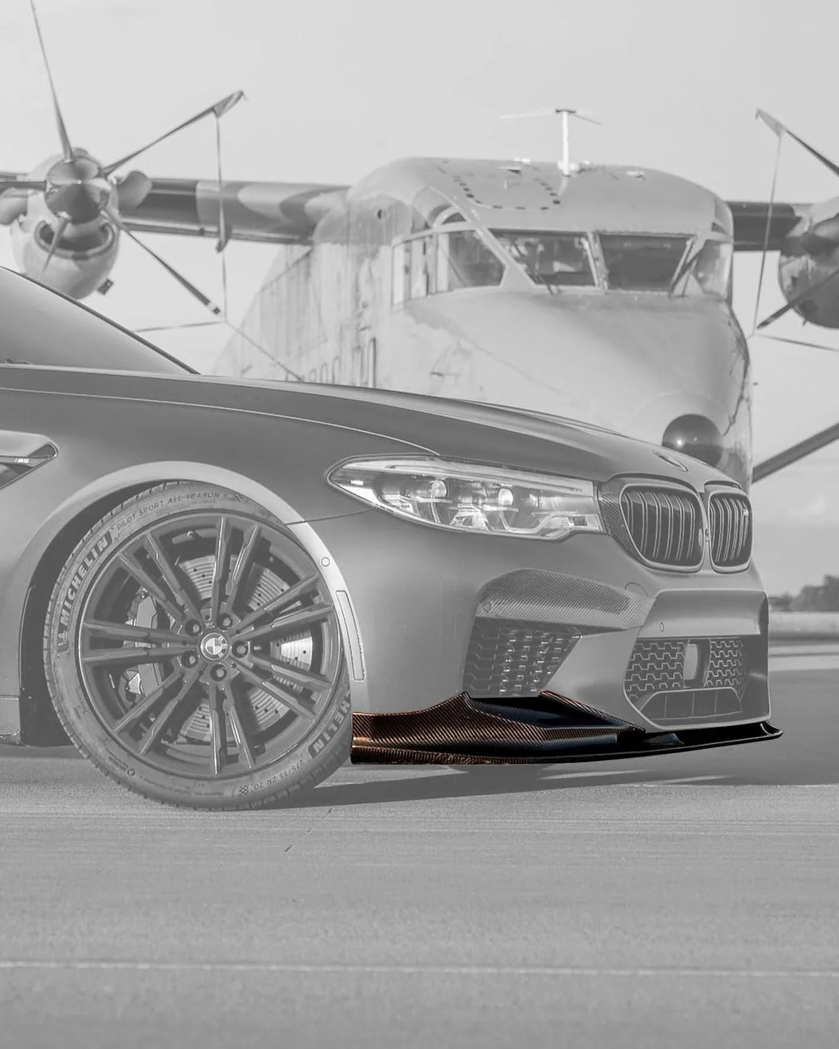 BMW 5 Series F90 M5 carbon fiber front lip by K2 Industries, showcasing a sleek 3D style design on the vehicle's front bumper.