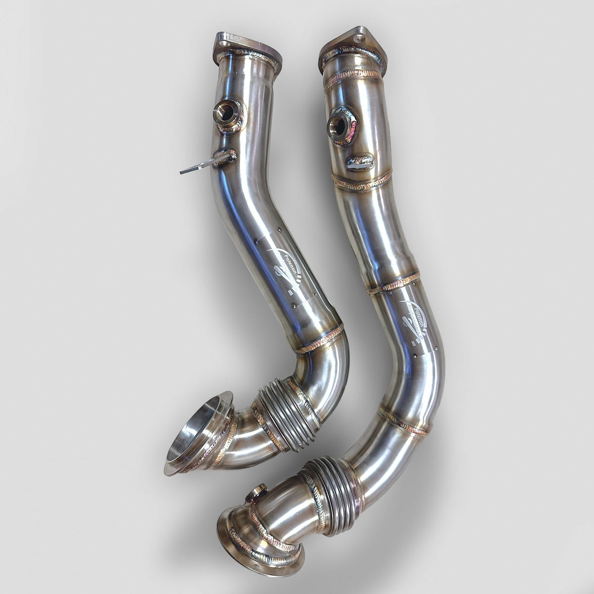 Palenon Performance N54 racing downpipe for BMW 1M, 135i, 335i, 335is, 335Xi, shown in black metal with mounting details.