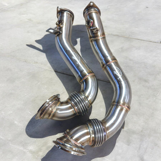 Palenon Performance N54 racing downpipe for BMW 1M, 135i, 335i, 335is, and 335xi, showing the sleek metal pipe design.