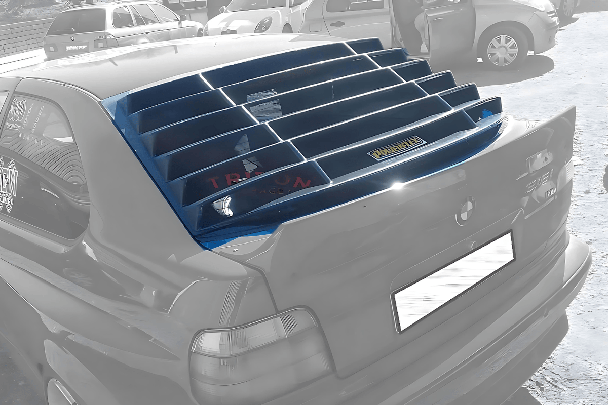 Black BMW E36 Compact Series 3 windshield louvers by K2 Industries, designed for 1992-1999 models, shown in a photo.