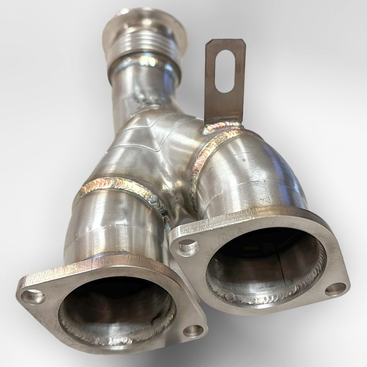 BMW N55 catless downpipe from Palenon Performance for E82 135i, E9X 335i, and E84 X1, showing the stainless steel pipe and flanges.