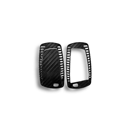 BMW X5, X6, X1 carbon fiber key cover by Palenon Performance, showing sleek black textured design on a car key.